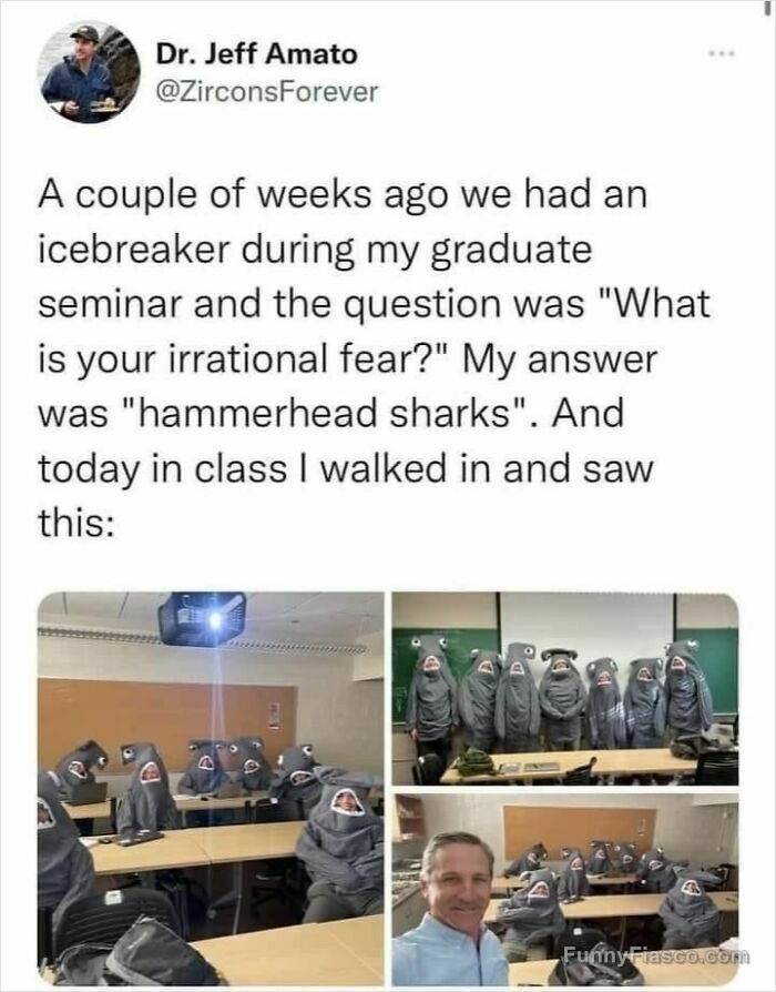 Classroom of students dressed in hammerhead shark costumes, surprising teacher.