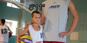 Tall person next to short person labeled with heights 6' and 5'11"