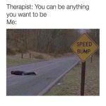 Person lying on road as a speed bump next to sign, dark humor