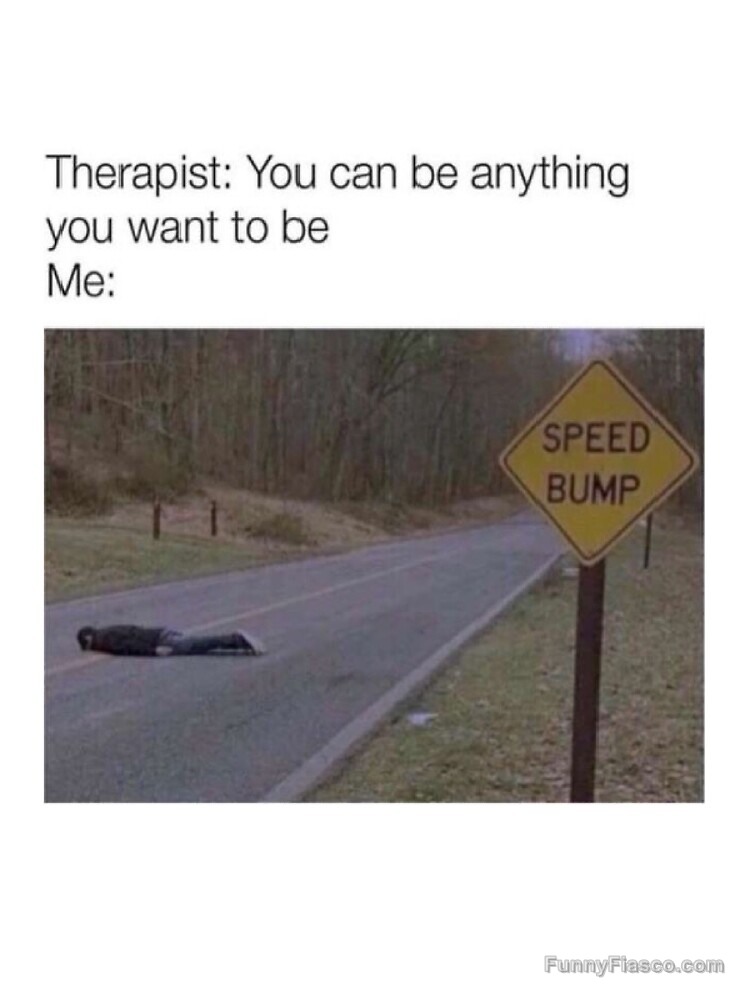 Person lying on road as a speed bump next to sign, dark humor