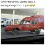 Wacky red car resembling a child’s drawing at a gas station.