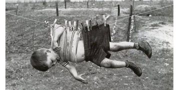 Vintage meme of a child hanging on a clothesline with a warning about mom.