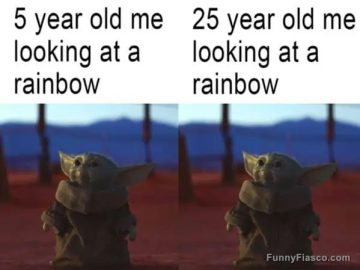 Young and adult both enjoying a rainbow with equal delight