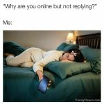 Person asleep holding phone, ignoring messages online.