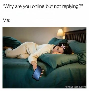 Person asleep holding phone, ignoring messages online.