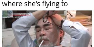 Man facepalming after awkward plane conversation mishap.