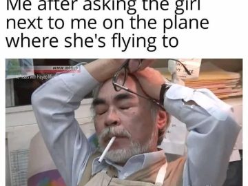 Man facepalming after awkward plane conversation mishap.