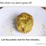 Potato on plate humorously representing waking up with alarm.