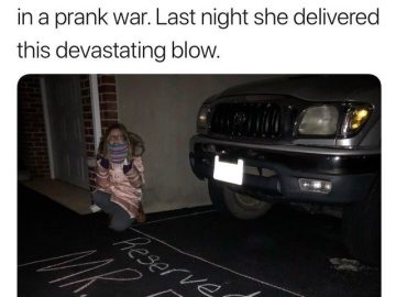 Child's prank with chalk: "Reserved for Mr. Fart" on driveway