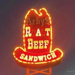 Neon sign mishap shows "Rat Beef Sandwich" instead of roast beef.