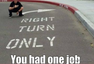 Road marking fail with wrong arrow pointing left for right turn.