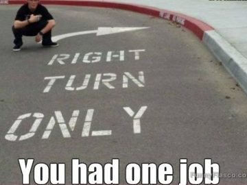 Road marking fail with wrong arrow pointing left for right turn.