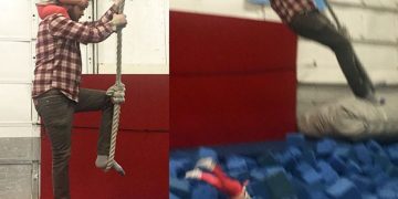 Man and child on rope swing; unexpected fall into foam pit.