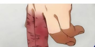 Hand struggling to put on shoe without untying it