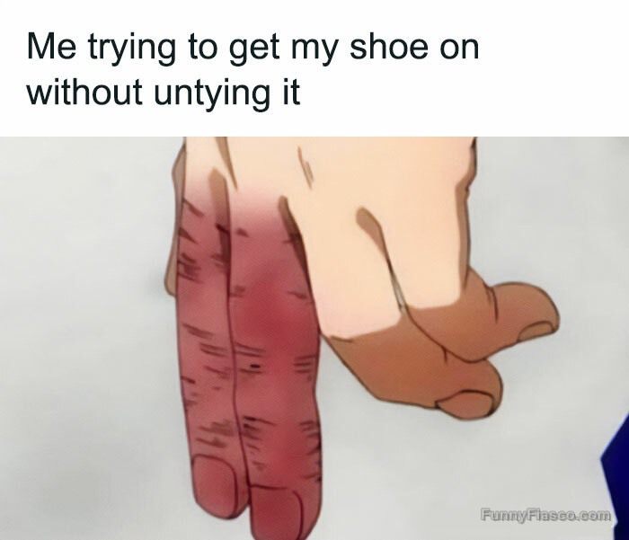 Hand struggling to put on shoe without untying it