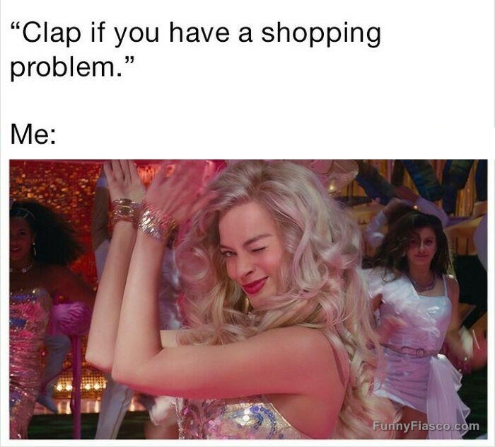 Woman clapping with a wink, embracing her shopping addiction.