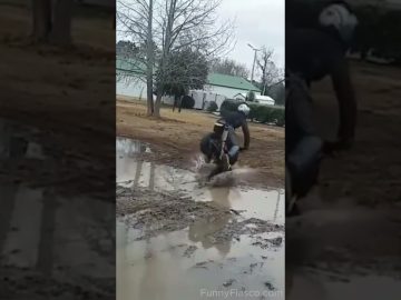 Mini bike rider losing control while attempting a muddy puddle stunt in a funny fail compilation.