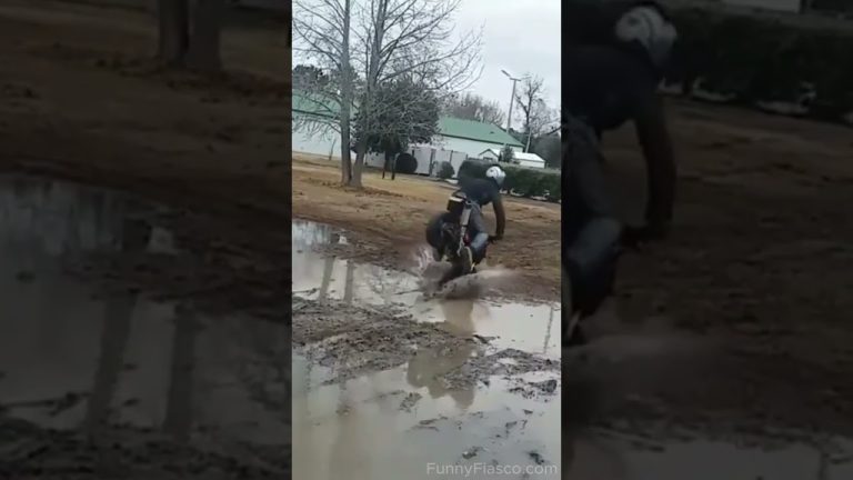 Mini bike rider losing control while attempting a muddy puddle stunt in a funny fail compilation.