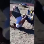 Man loses balance on a muddy ridge before falling toward the water in a funny wipeout compilation.