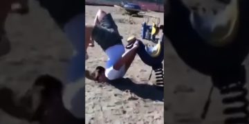 Man loses balance on a muddy ridge before falling toward the water in a funny wipeout compilation.