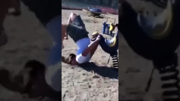 Man loses balance on a muddy ridge before falling toward the water in a funny wipeout compilation.