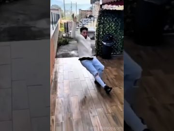 Person losing balance on a small bathroom ladder before outdoor water and street fails follow
