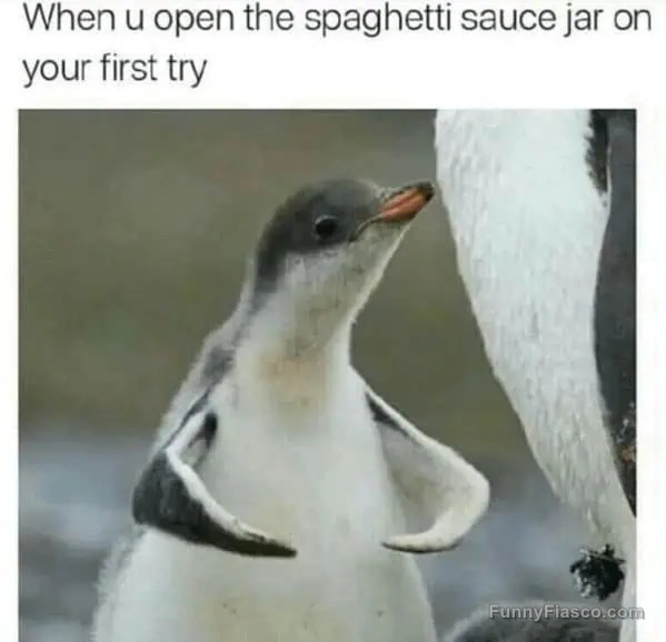 Proud penguin chick celebrates opening a jar effortlessly.